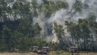 Incendie fixé, mais pas encore maîtrisé, alors que la canicule s'annonce